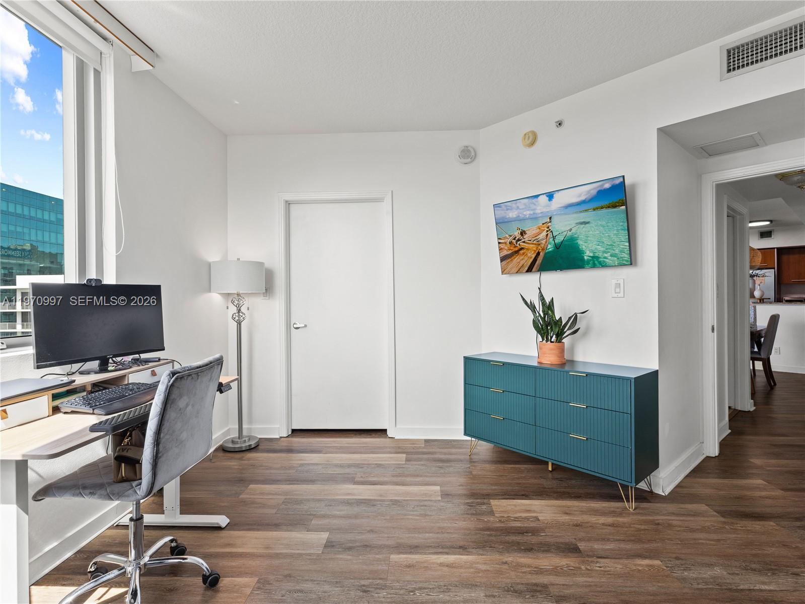 9066 Southwest 73rd Court, Unit 2008 Miami, FL 33156 - Photo 21 of 35 a workspace with furniture and window