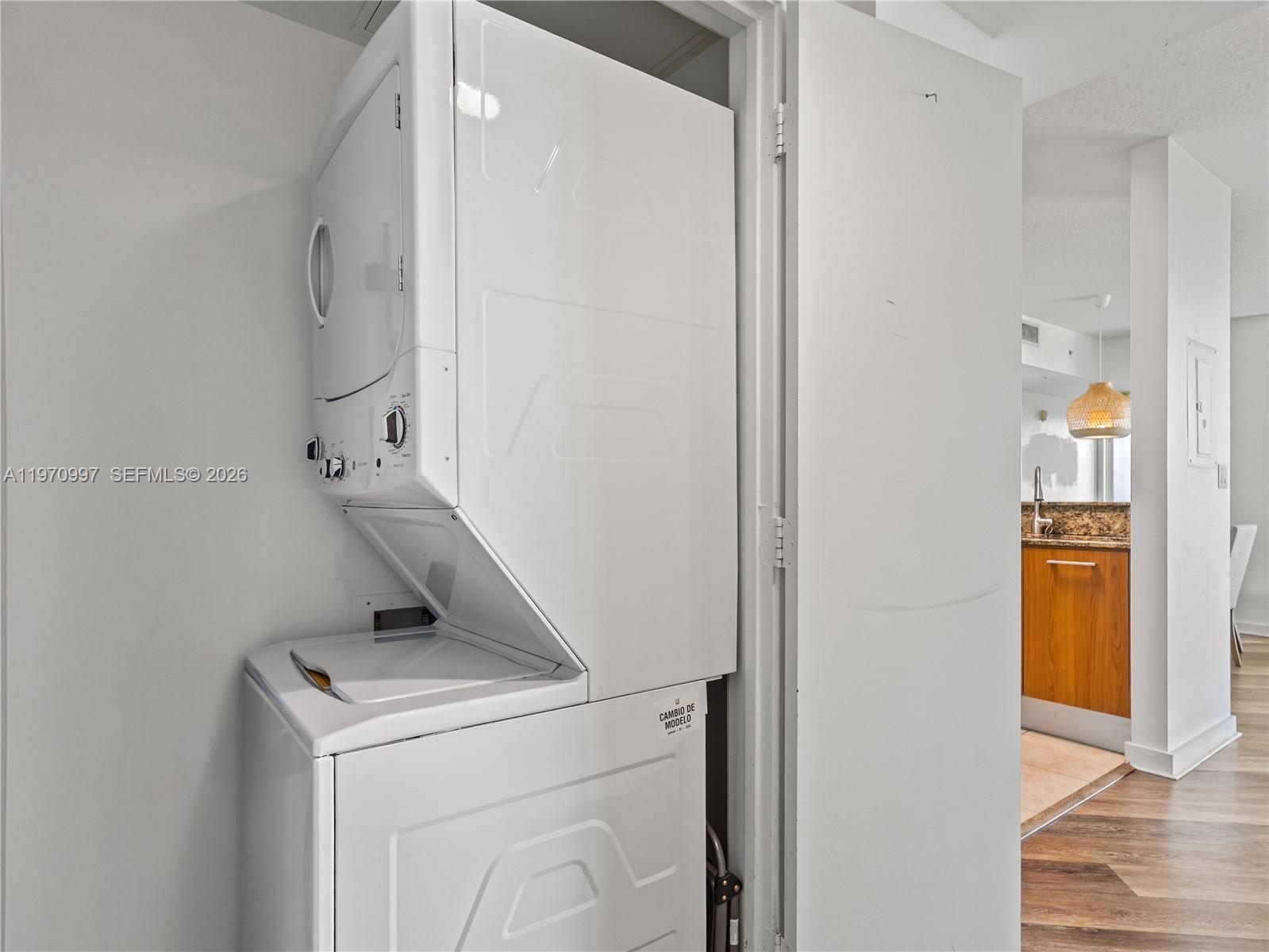 9066 Southwest 73rd Court, Unit 2008 Miami, FL 33156 - Photo 25 of 35 a utility room with dryer and washer