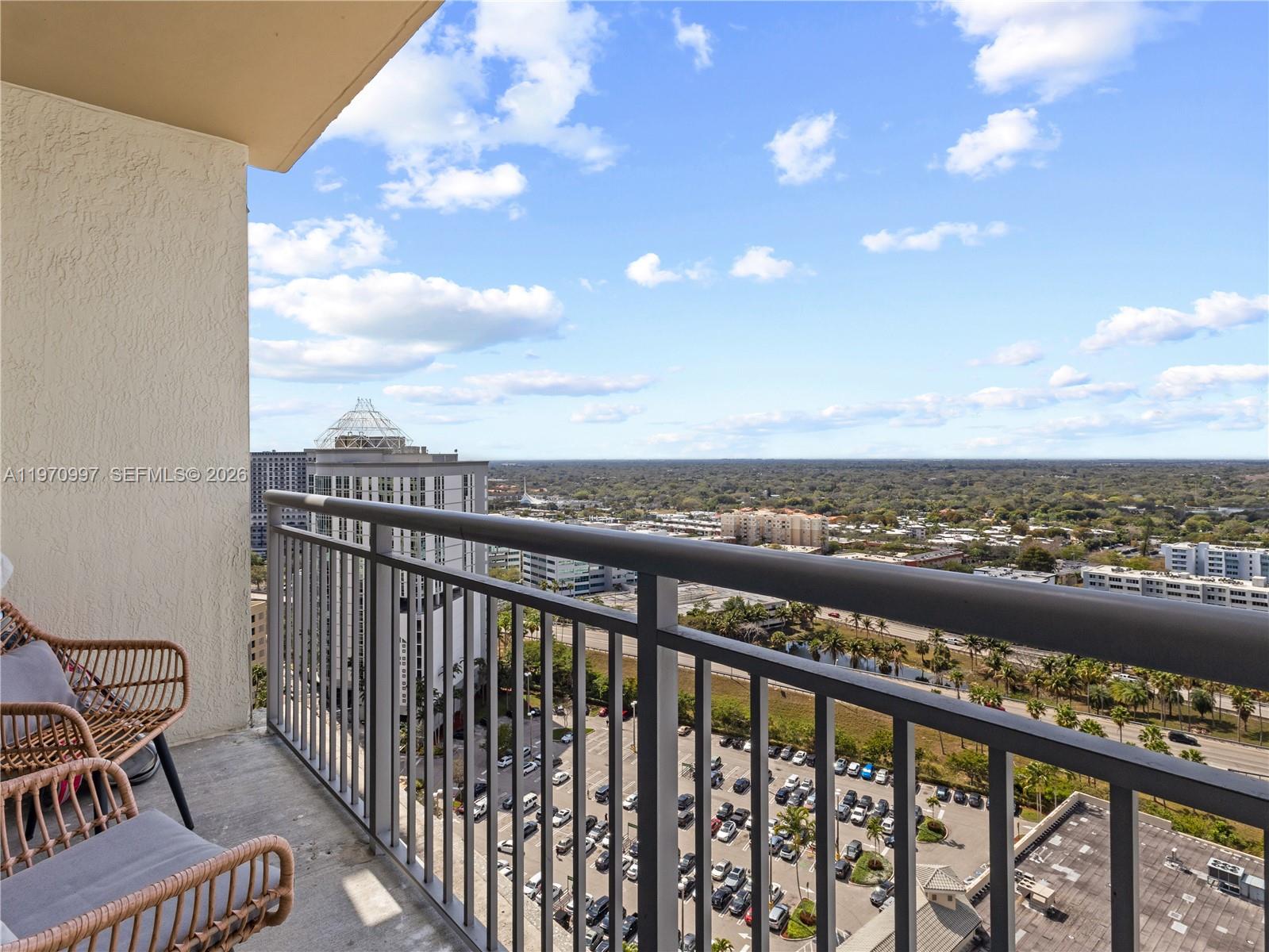 9066 Southwest 73rd Court, Unit 2008 Miami, FL 33156 - Photo 26 of 35 a view of city from a balcony