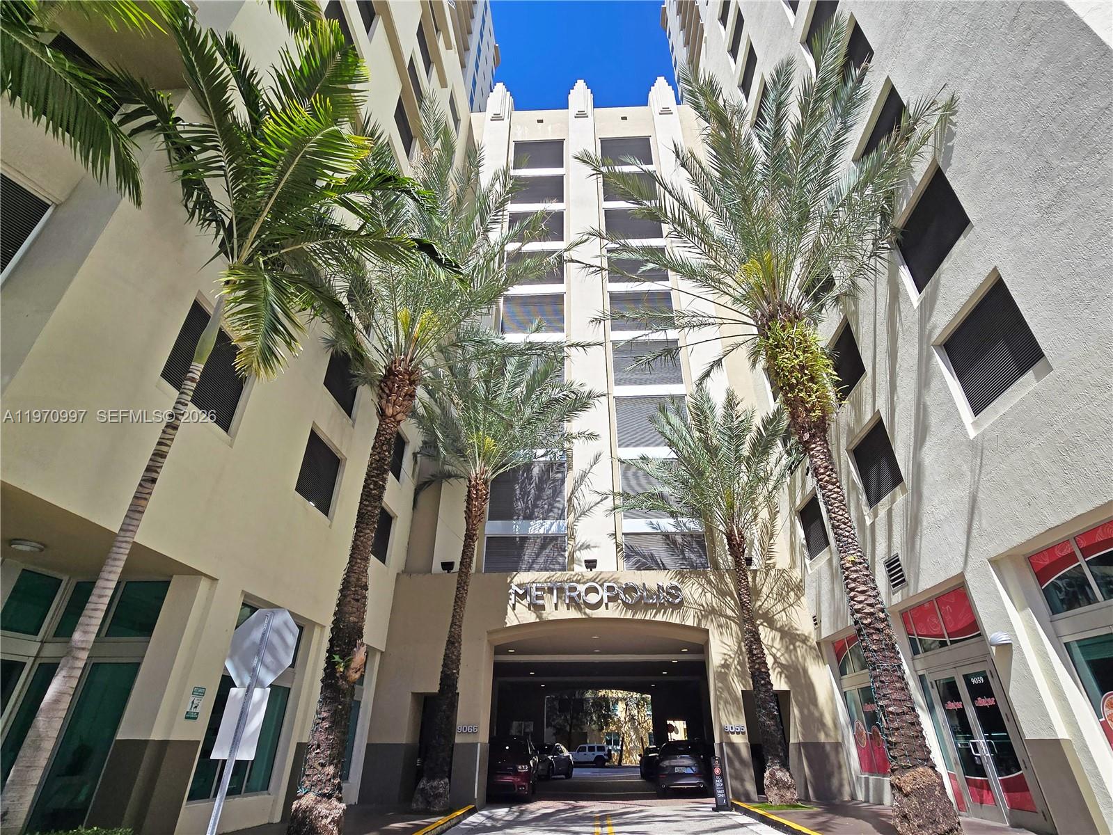 9066 Southwest 73rd Court, Unit 2008 Miami, FL 33156 - Photo 28 of 35 a view of a building with a street