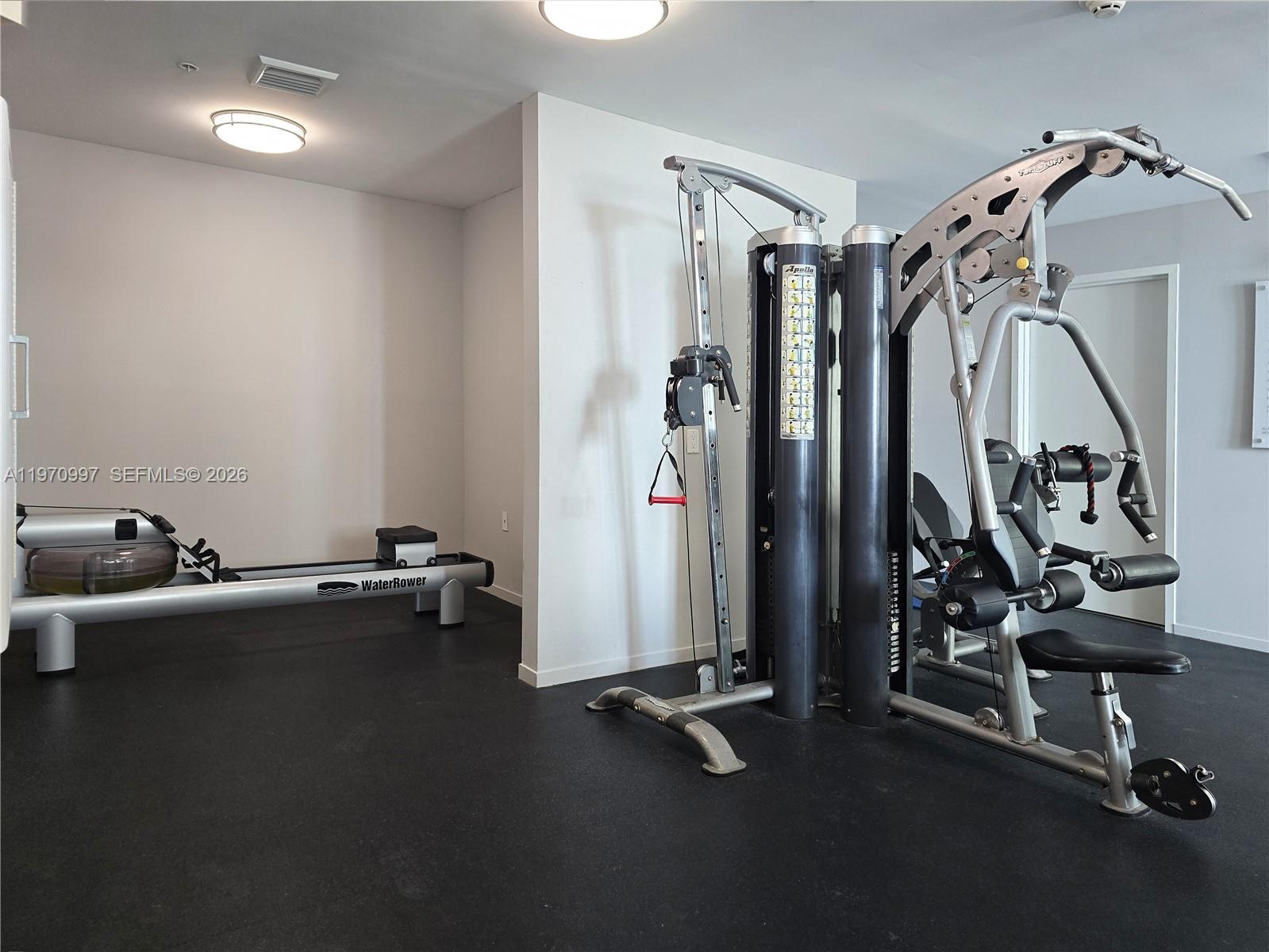 9066 Southwest 73rd Court, Unit 2008 Miami, FL 33156 - Photo 31 of 35 a view of a room with gym equipment
