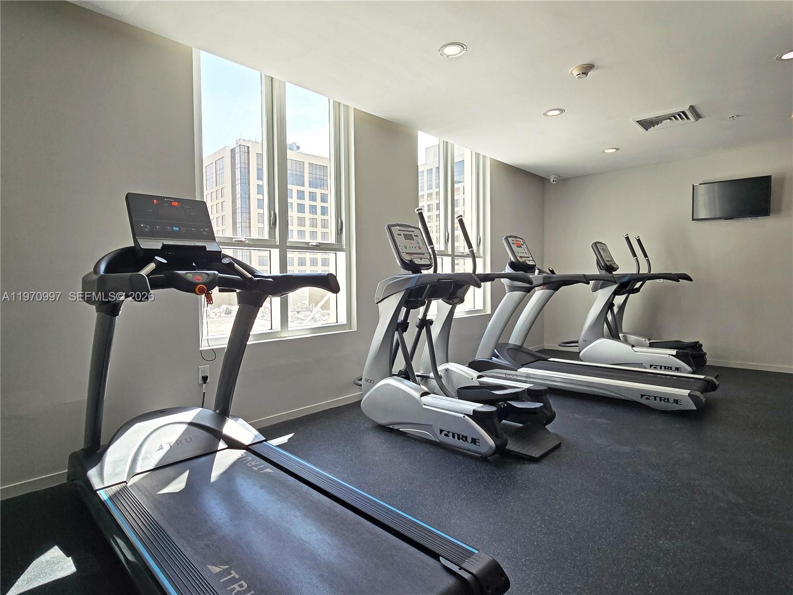 9066 Southwest 73rd Court, Unit 2008 Miami, FL 33156 - Photo 32 of 35 a view of a room with gym equipment