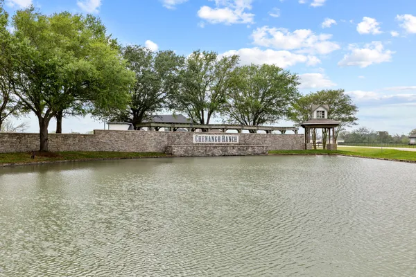 a view of a golf course with a lake view