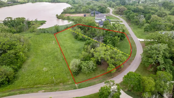 an aerial view of lake residential house with outdoor space and seating space
