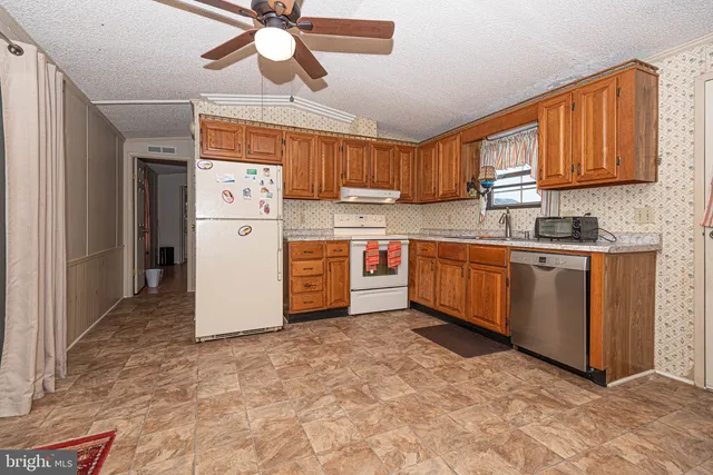 a kitchen with a sink cabinets and window