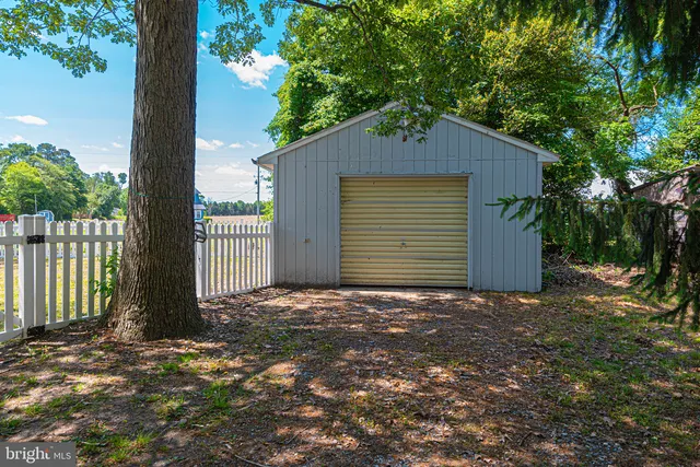 a aerial view of a house with swimming pool and a yard