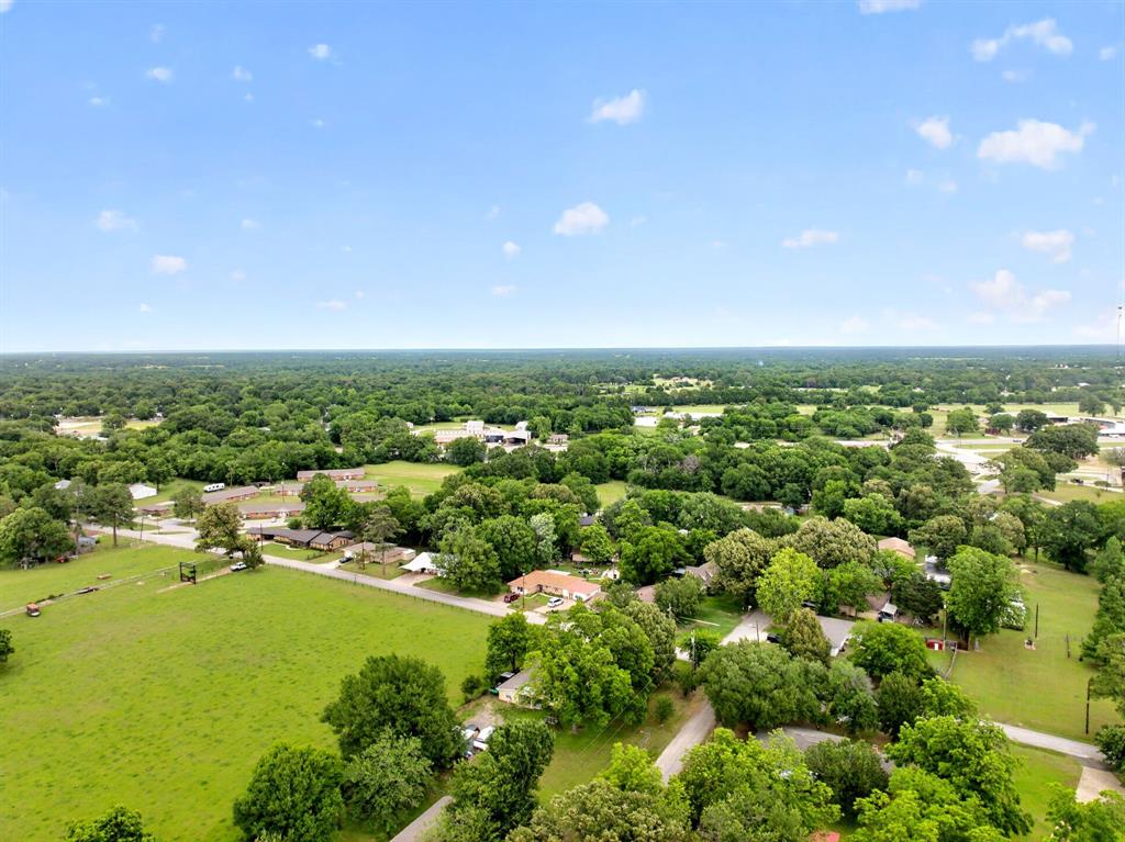 610 Crooked Creek Road Edgewood, TX 75117 - Photo 32 of 33 an aerial view of residential houses with outdoor space and trees