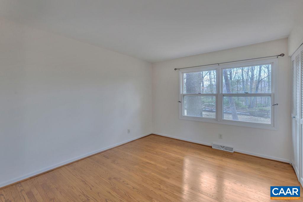 385 Gillums Ridge Road Charlottesville, VA 22903 - Photo 12 of 34 an empty room with a window