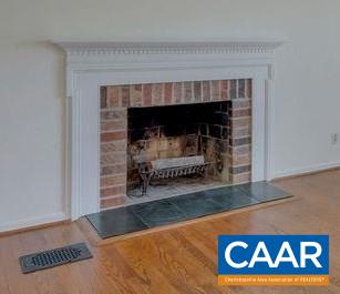 385 Gillums Ridge Road Charlottesville, VA 22903 - Photo 4 of 34 a view of fireplace and a wooden floor in a room