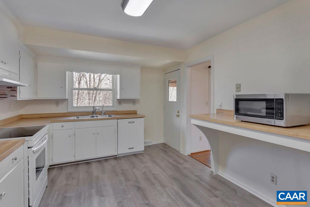 385 Gillums Ridge Road Charlottesville, VA 22903 - Photo 6 of 34 a kitchen with a sink cabinets and window