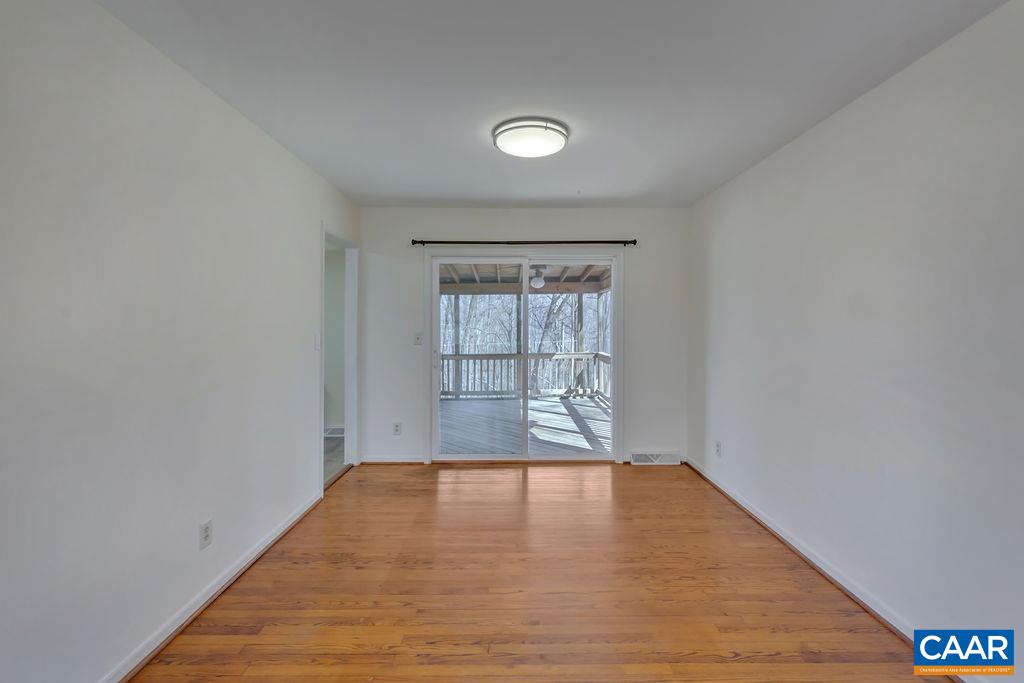 385 Gillums Ridge Road Charlottesville, VA 22903 - Photo 7 of 34 wooden floor in an empty room with a window