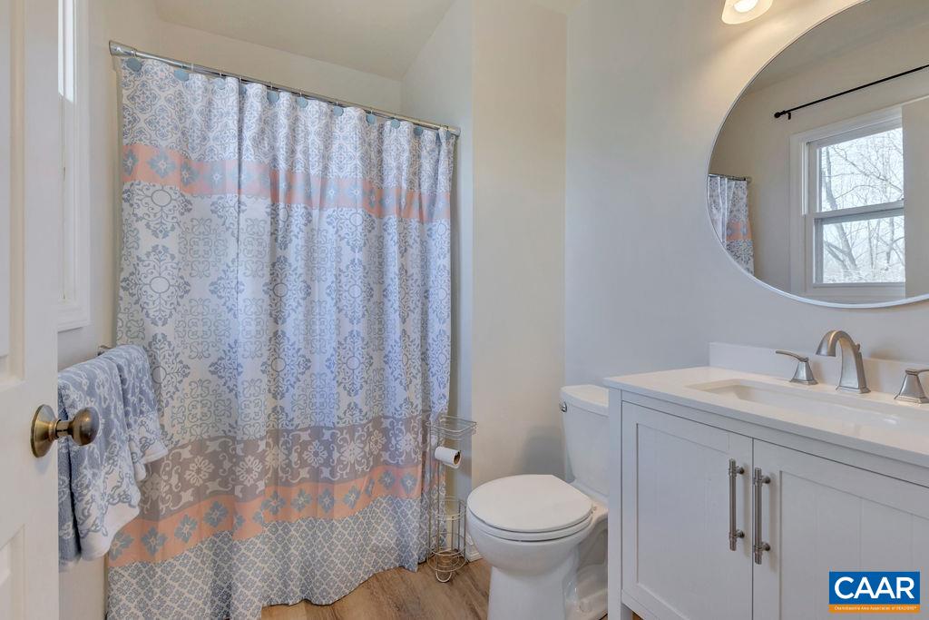 385 Gillums Ridge Road Charlottesville, VA 22903 - Photo 9 of 34 a bathroom with a sink toilet and shower