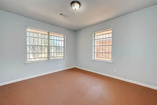 an empty room with windows