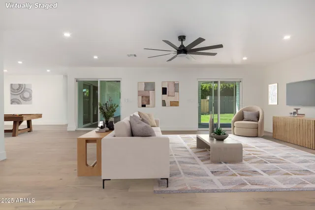 a living room with furniture and a large window