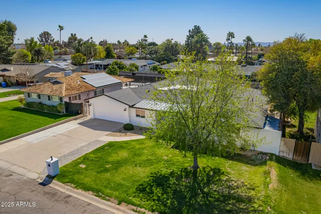 an aerial view of a house with a garden