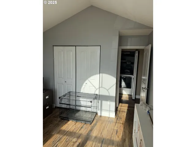 a view of a living room with wooden floor