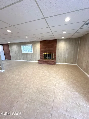 a kitchen with stainless steel appliances granite countertop a refrigerator a stove a sink and a microwave