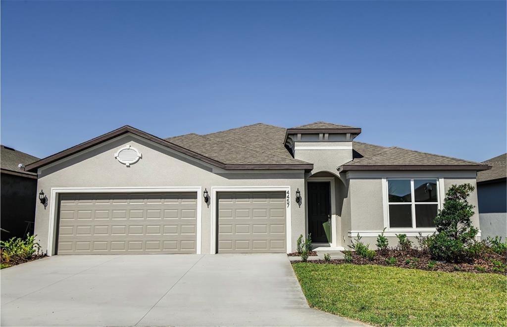 4457 Southwest 84th St Road Ocala, FL 34476 - Photo 1 of 1 a front view of a house with garden