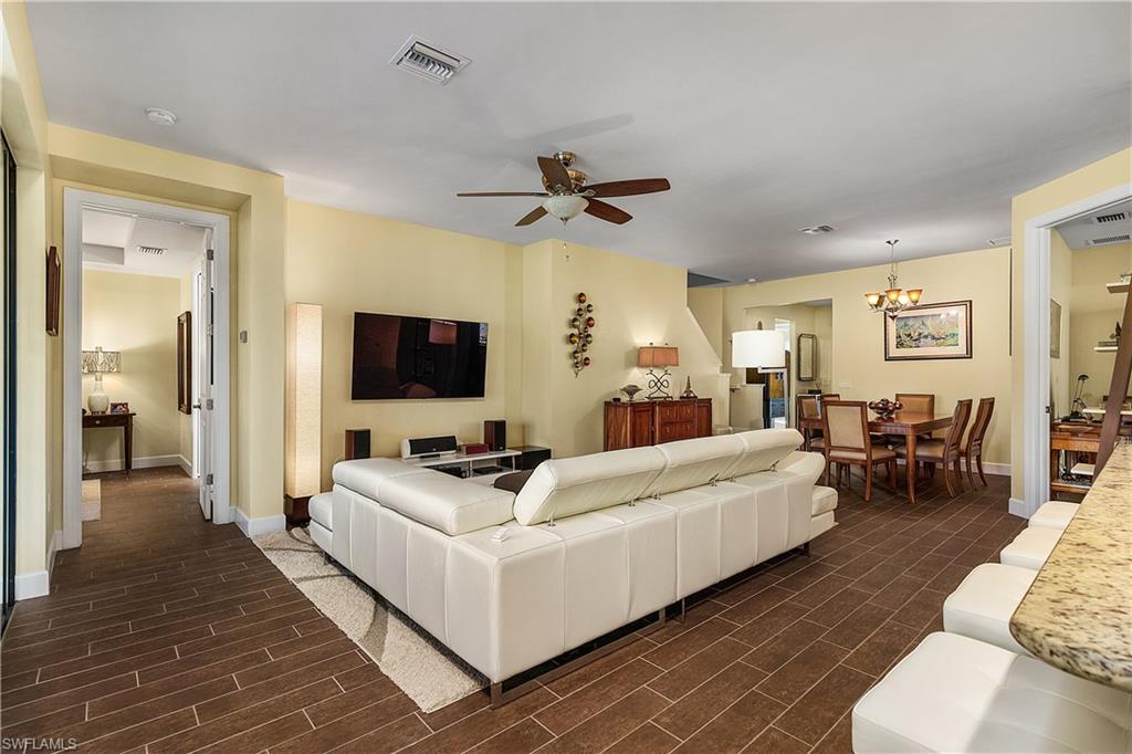 16309 Winfield Lane Naples, FL 34110 - Photo 14 of 35 a living room with furniture and a flat screen tv