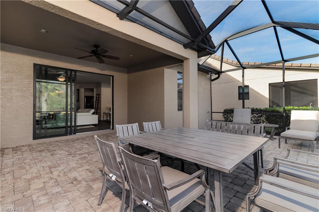 16309 Winfield Lane Naples, FL 34110 - Photo 22 of 35 a view of a dinning table and chairs in patio
