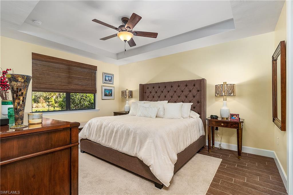 16309 Winfield Lane Naples, FL 34110 - Photo 23 of 35 a bedroom with a large bed and a window