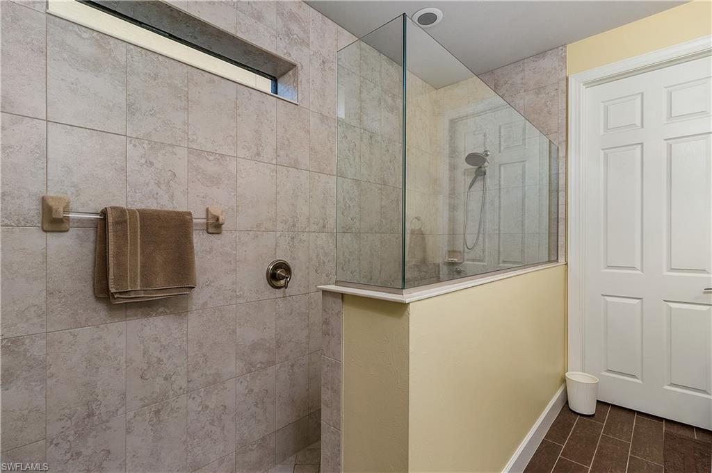 16309 Winfield Lane Naples, FL 34110 - Photo 25 of 35 a bathroom with a shower