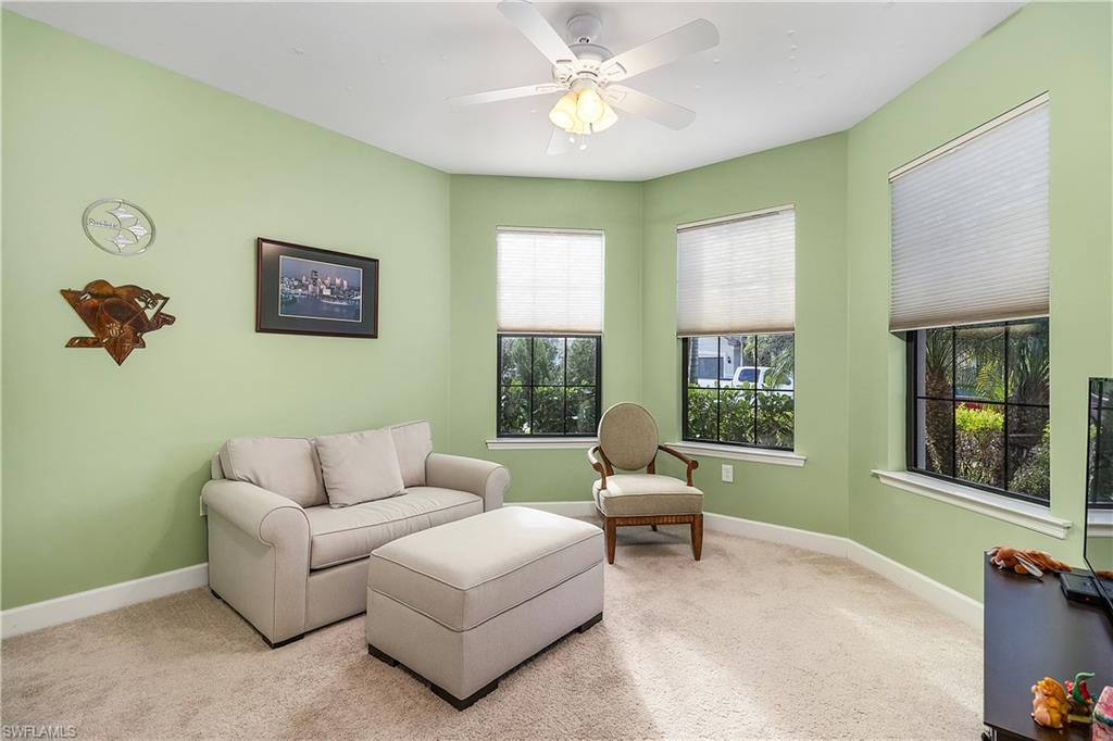 16309 Winfield Lane Naples, FL 34110 - Photo 27 of 35 a living room with furniture and a window