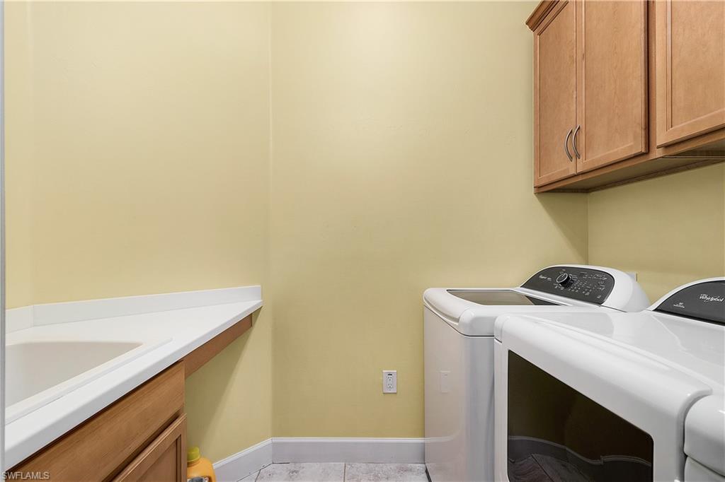 16309 Winfield Lane Naples, FL 34110 - Photo 28 of 35 a utility room with dryer and washer