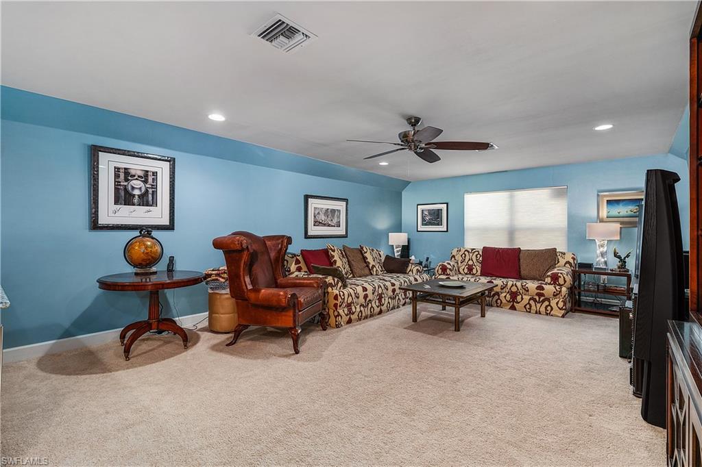 16309 Winfield Lane Naples, FL 34110 - Photo 29 of 35 a living room with furniture and a window