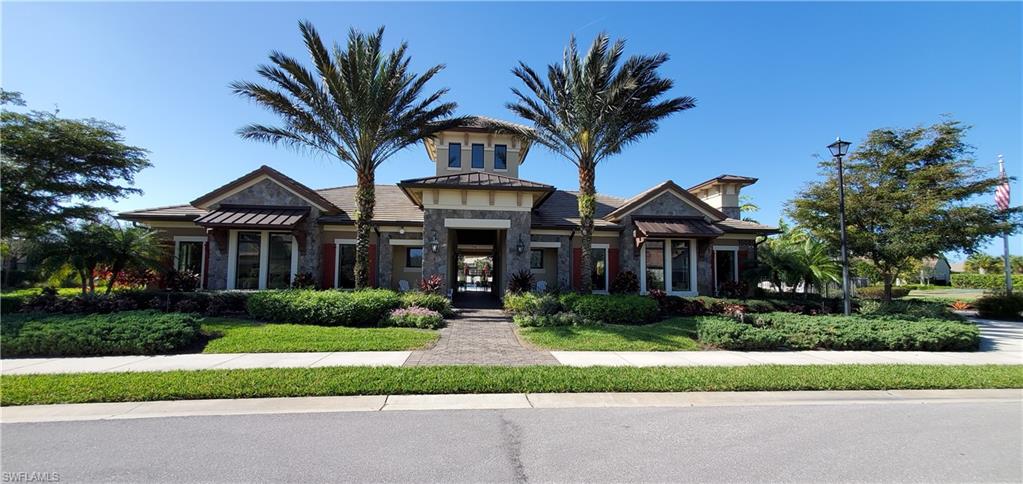 16309 Winfield Lane Naples, FL 34110 - Photo 32 of 35 a front view of house with yard and green space