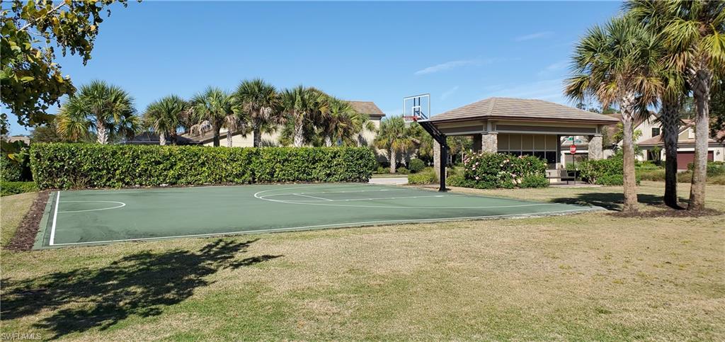 16309 Winfield Lane Naples, FL 34110 - Photo 33 of 35 a front view of a house with a yard
