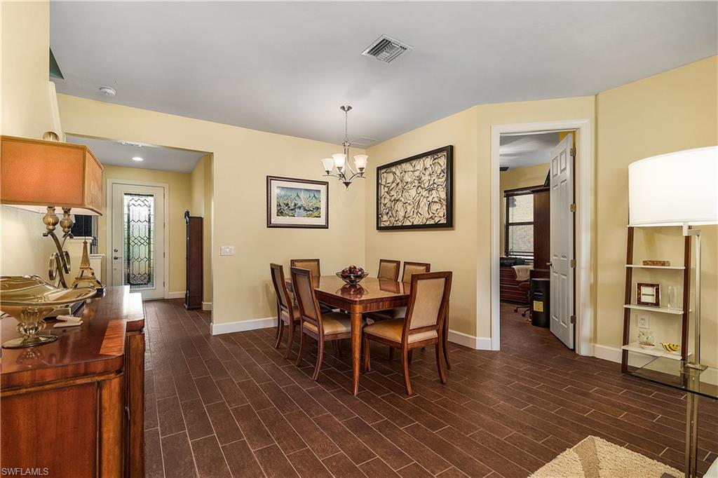 16309 Winfield Lane Naples, FL 34110 - Photo 8 of 35 a dining room with furniture and window