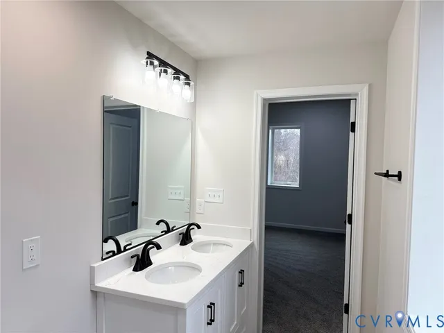 a bathroom with a sink and mirror