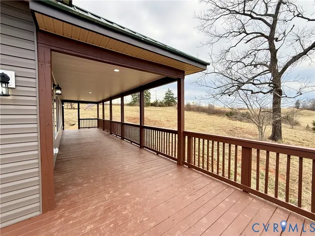 a view of a balcony with wooden floor