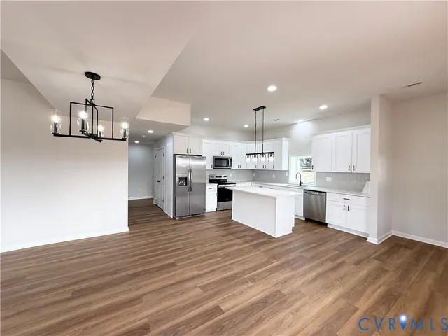 a view of kitchen with wooden floor