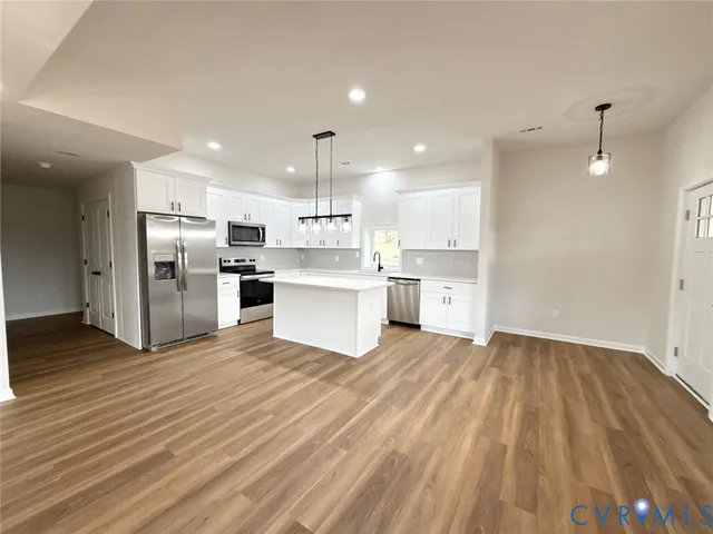 a view of kitchen with wooden floor