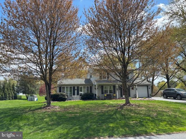 123 Tracy Berg Road Lancaster, PA 17603 - Photo 1 of 27 a front view of a house with a garden