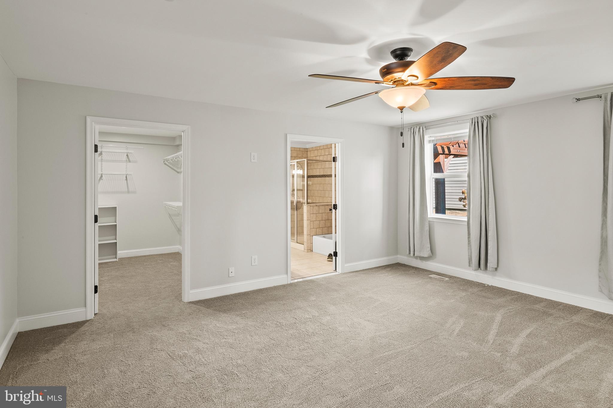 2201 Alvin Avenue Baltimore, MD 21228 - Photo 17 of 39 a view of empty room with wooden floor and fan