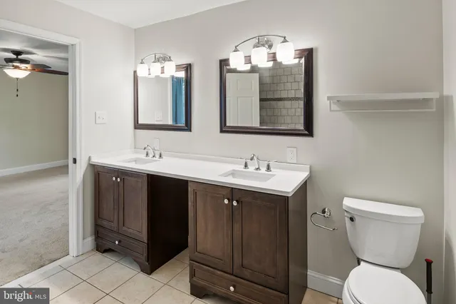 a view of a hallway with wooden floor and dining room