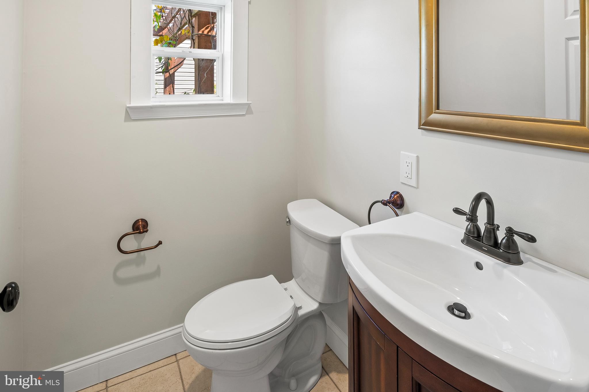 2201 Alvin Avenue Baltimore, MD 21228 - Photo 22 of 39 a bathroom with a sink and a toilet
