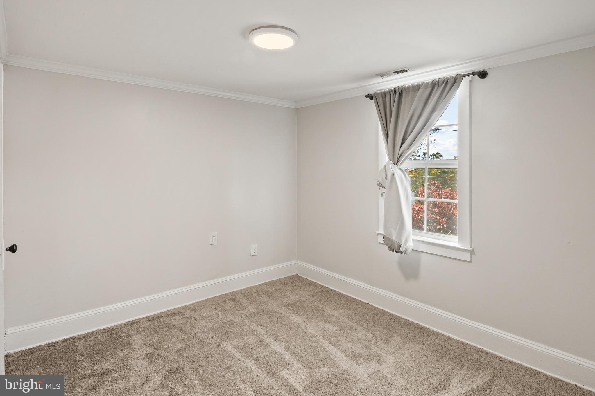 2201 Alvin Avenue Baltimore, MD 21228 - Photo 24 of 39 an empty room with windows