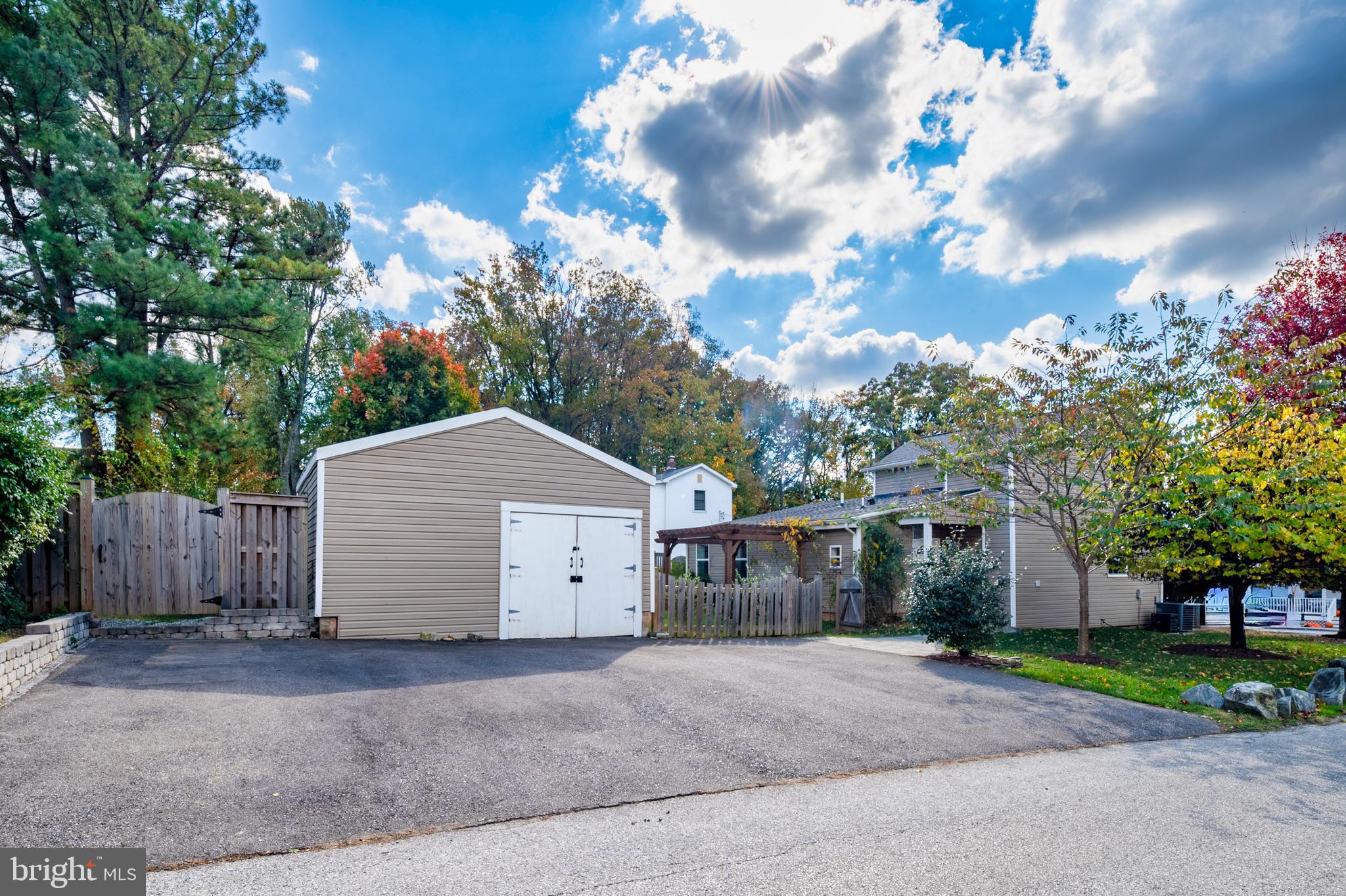 2201 Alvin Avenue Baltimore, MD 21228 - Photo 32 of 39 a view of a house with a yard and tree