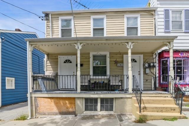 a front view of a house with a porch