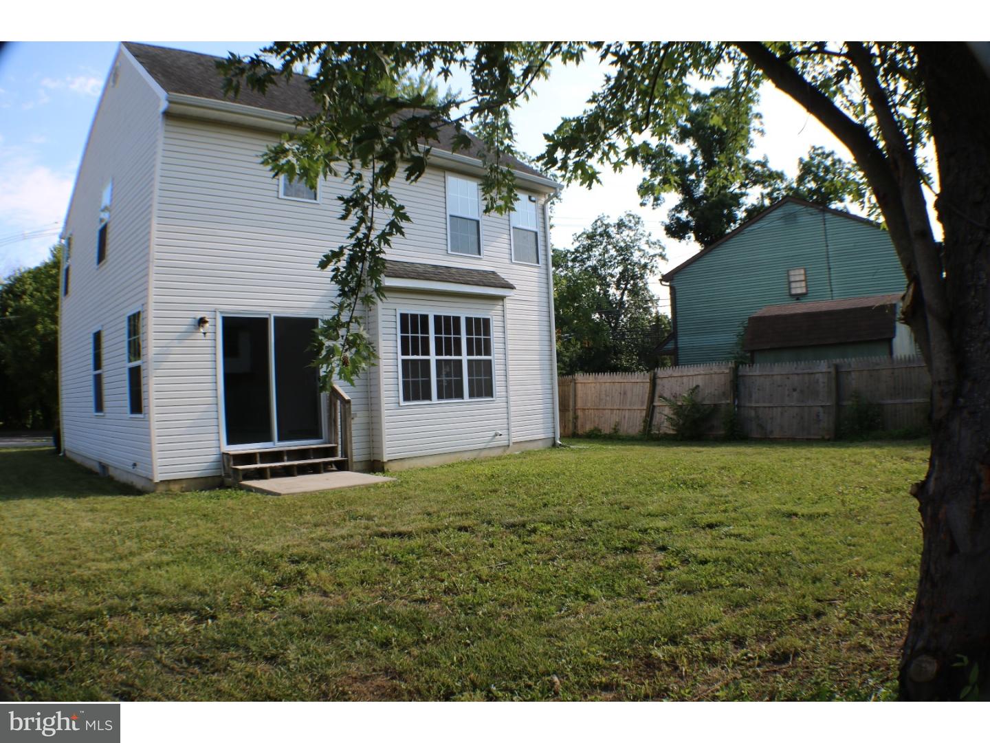 437 Almonesson Road Blackwood, NJ 08012 - Photo 17 of 17 a white house with a small yard and large trees