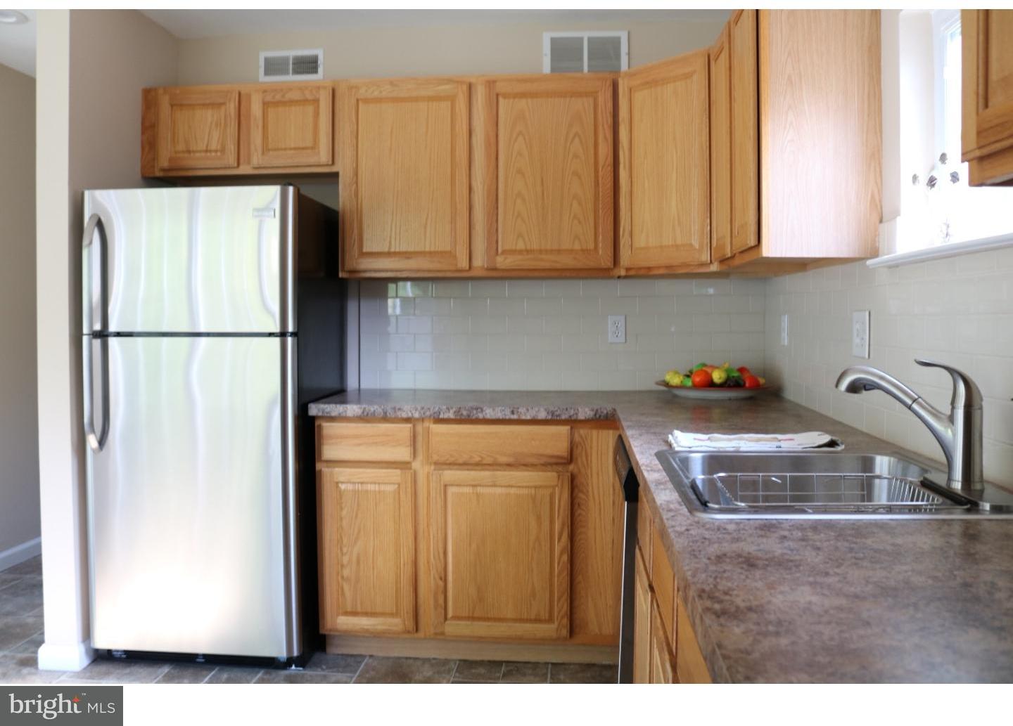 437 Almonesson Road Blackwood, NJ 08012 - Photo 2 of 17 a kitchen with stainless steel appliances granite countertop a refrigerator sink and cabinets