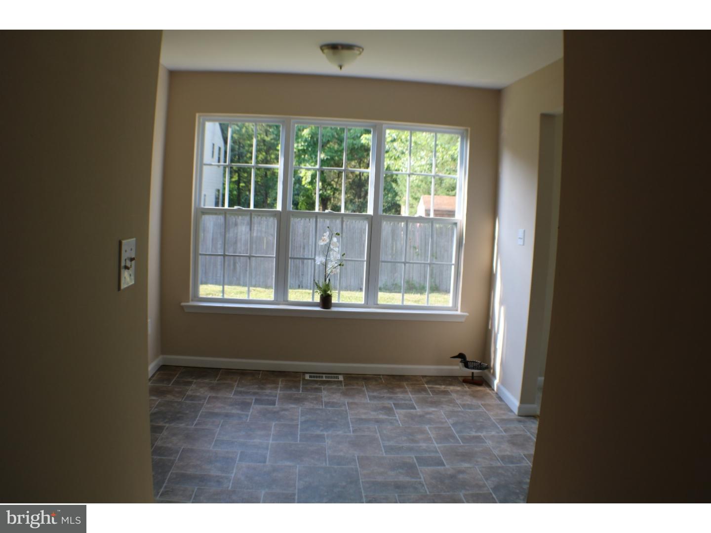 437 Almonesson Road Blackwood, NJ 08012 - Photo 4 of 17 a view of an empty room with wooden floor and a window
