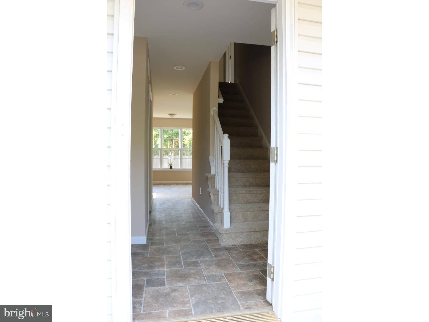 437 Almonesson Road Blackwood, NJ 08012 - Photo 7 of 17 a view of a hallway with wooden floor