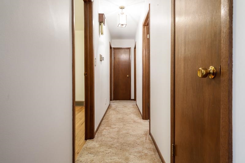 1110 Roxbury Close Rockford, IL 61107 - Photo 21 of 36 a view of a hallway with wooden floor
