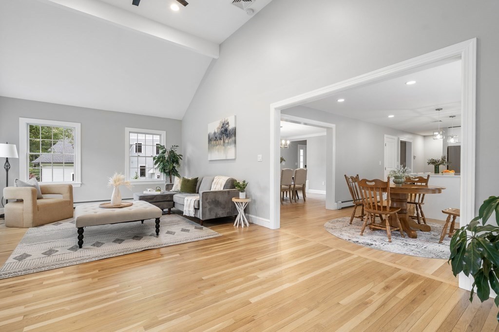 11 Fort Pond Road Acton, MA 01720 - Photo 12 of 40 a living room with furniture and a dining table with wooden floor