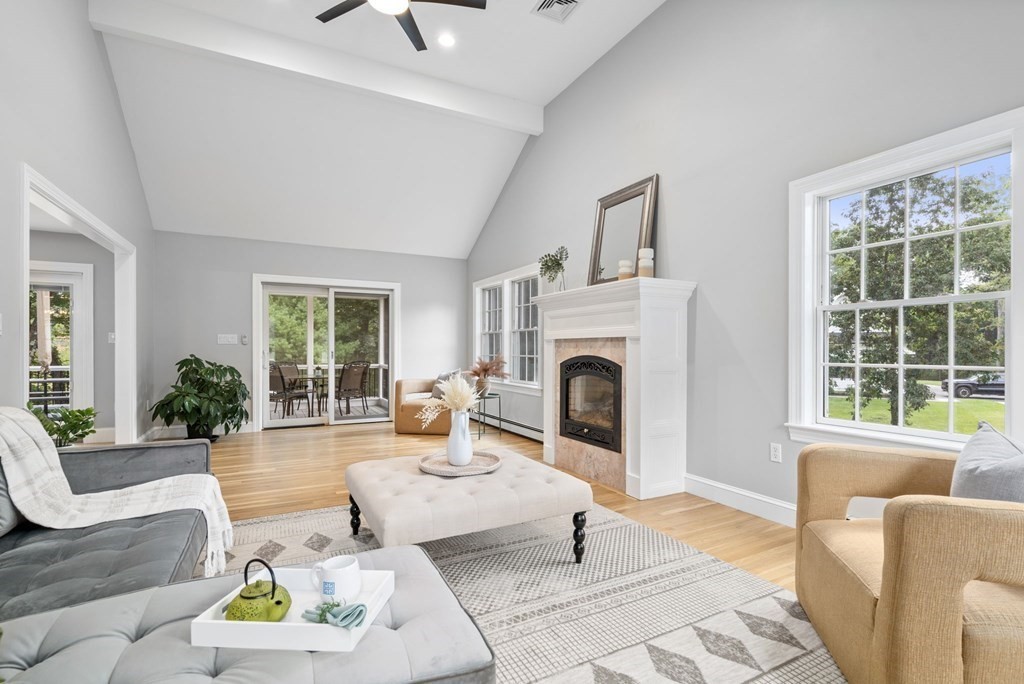 11 Fort Pond Road Acton, MA 01720 - Photo 13 of 40 a living room with furniture a window and a fireplace